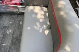 Slide: The Image of Gray seating with red trim in a 2023 Qwest RLS 822 boat. - 4