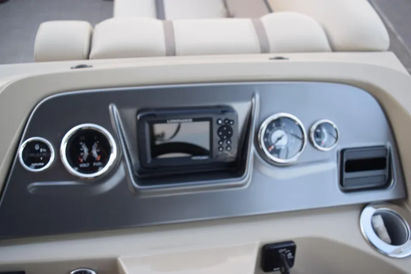 Slide: The Image of 2024 Crest Classic LX 200 L dashboard with gauges and navigation system. - 10