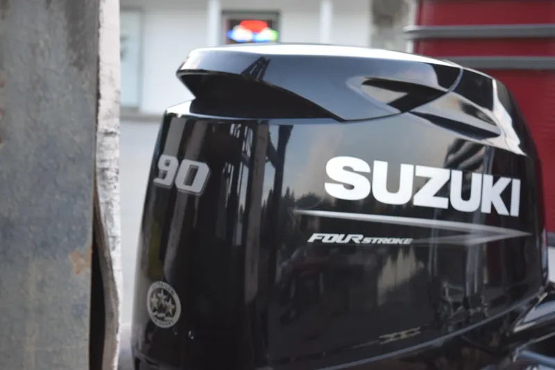 Slide: The Image of Suzuki 90 horsepower four-stroke outboard motor, black finish, close-up view. - 5