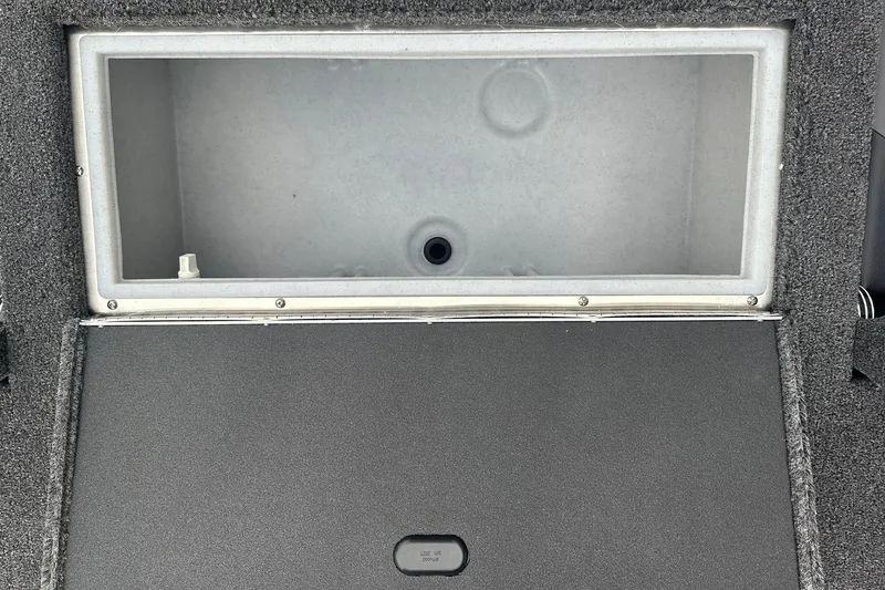 Slide: The Image of Open storage compartment in 2025 Crestliner 1750 Hawk boat, featuring a spacious interior. - 18