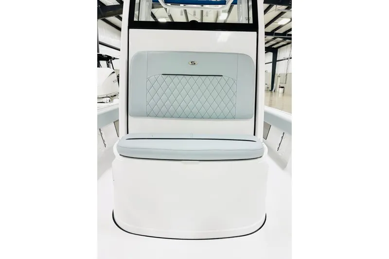 Slide: The Image of 2026 Sportsman Masters 227 Bay Boat seat with quilted upholstery in a showroom. - 10
