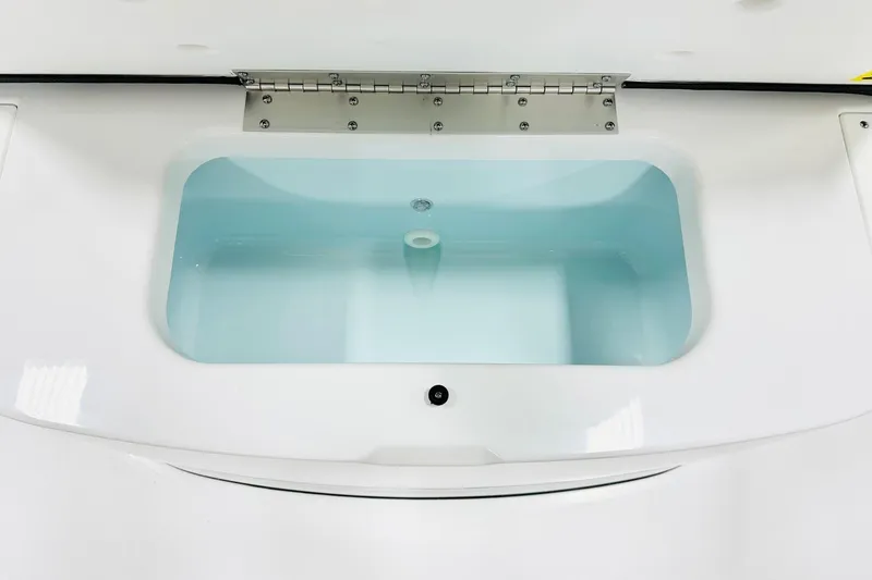 Slide: The Image of Livewell compartment in 2026 Sportsman Masters 227 Bay Boat, featuring a clean, white design. - 11