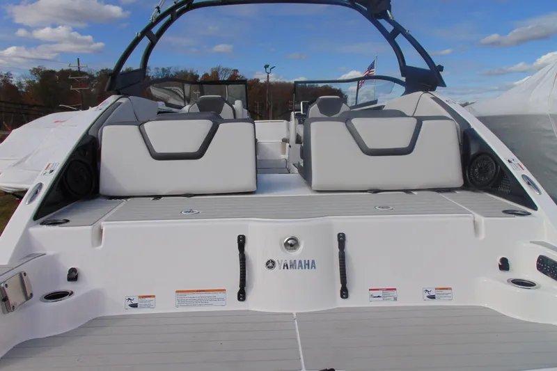 Slide: The Image of 2026 Yamaha Boats AR250, rear view, showcasing seating and deck design. - 15