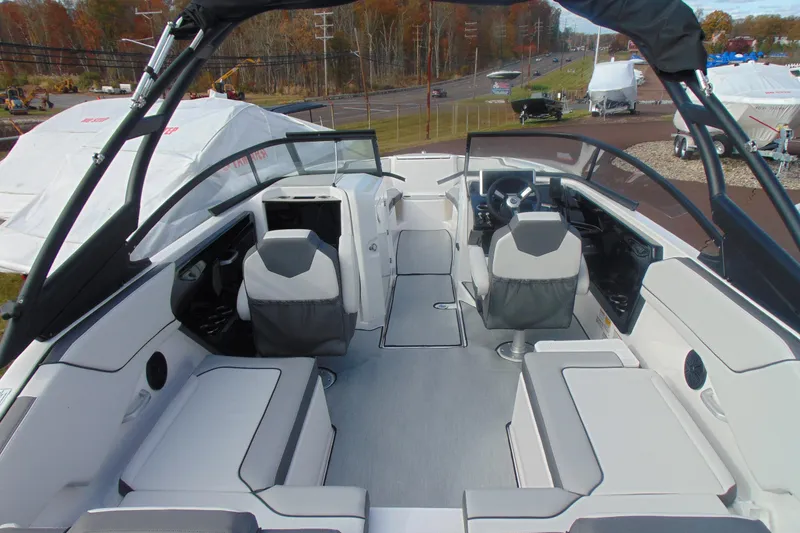 Slide: The Image of 2026 Yamaha Boats AR250 interior with modern seating and sleek design. - 16