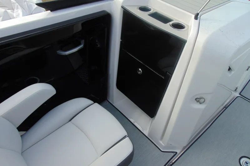 Slide: The Image of 2026 Yamaha Boats AR250 interior with seating and storage compartment. - 19