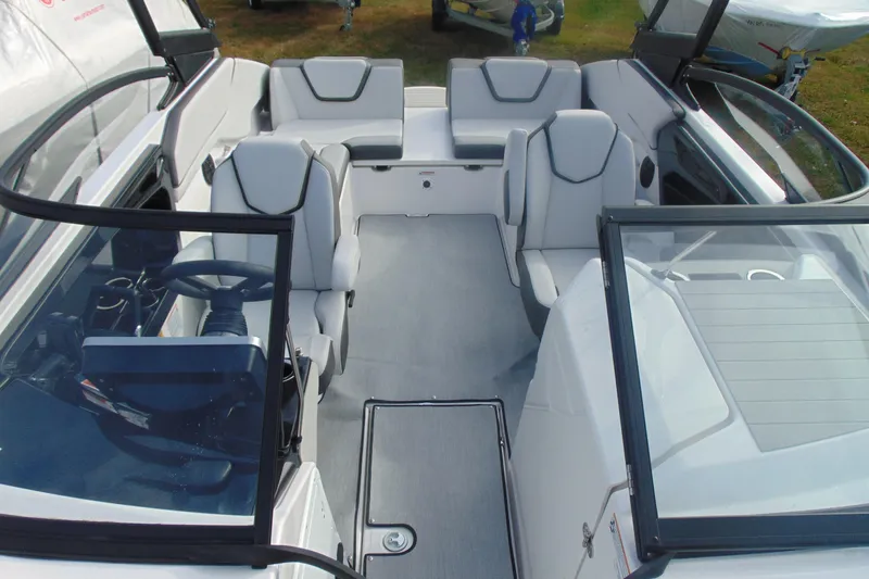 Slide: The Image of 2026 Yamaha Boats AR250 interior with modern seating and steering wheel. - 26