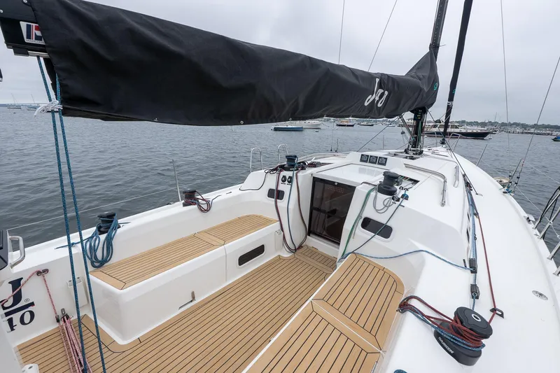 Slide: The Image of 2026 J Boats J/40 sailboat cockpit with teak decking, moored in a calm harbor. - 10