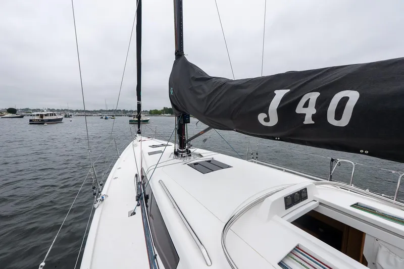 Slide: The Image of Sailing yacht J Boats J/40, 2026 model, on calm waters with overcast sky. - 16