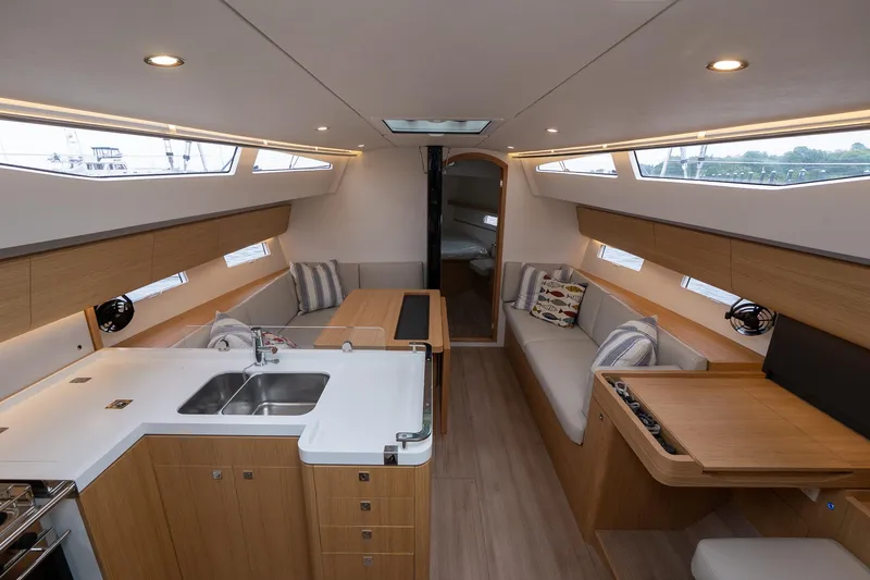 Slide: The Image of Modern interior of 2026 J Boats J/40 yacht with sleek wood finishes and spacious seating. - 25