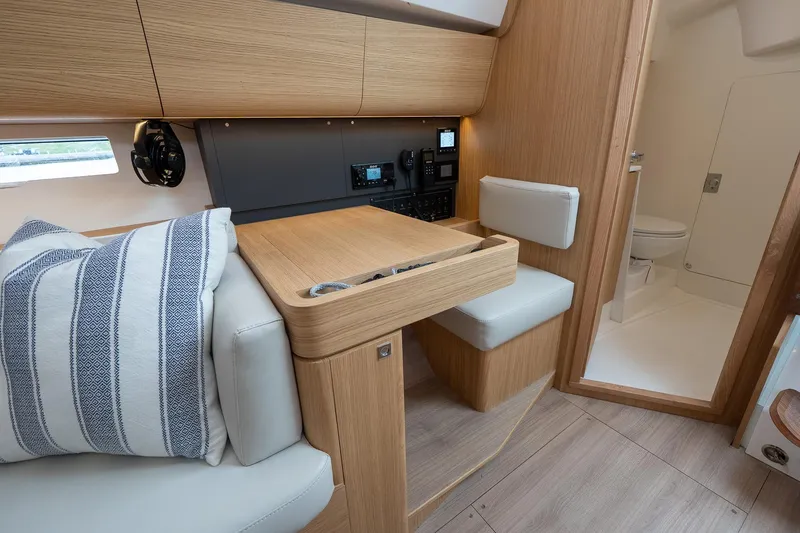 Slide: The Image of 2026 J Boats J/40 interior with navigation station and modern wood finish. - 31