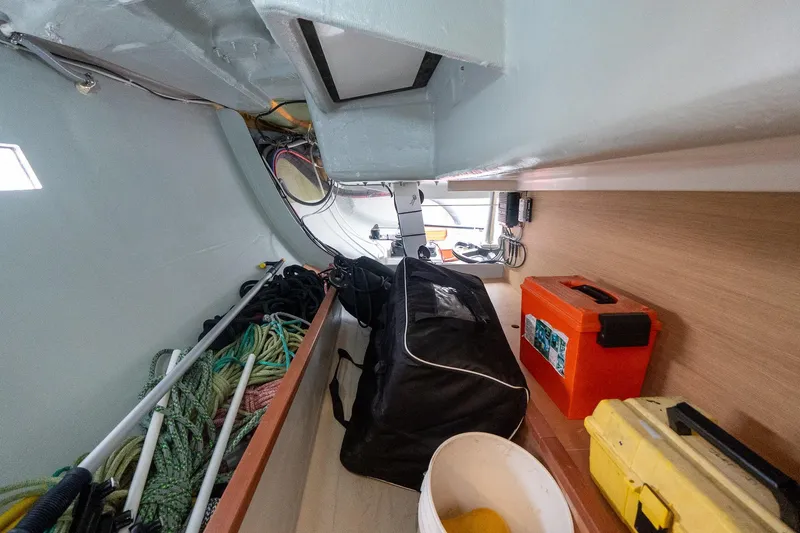 Slide: The Image of Interior of 2026 J Boats J/40 sailboat with ropes, bags, and toolboxes. - 35