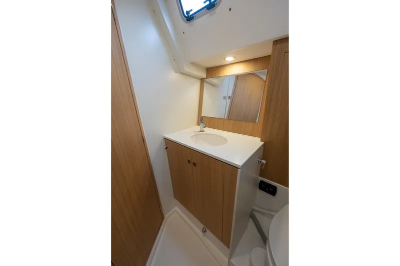 Slide: The Image of 2026 J Boats J/40 yacht bathroom with wooden cabinetry and modern sink. - 37