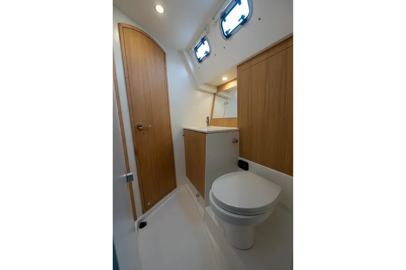 Slide: The Image of 2026 J Boats J/40 yacht bathroom with modern fixtures and wooden cabinetry. - 38