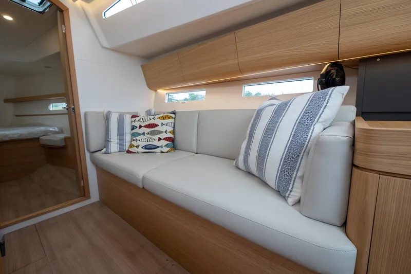 Slide: The Image of 2026 J Boats J/40 interior with modern seating and decorative pillows. - 41