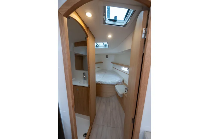 Slide: The Image of 2026 J Boats J/40 interior cabin with modern wood finish and skylight. - 44