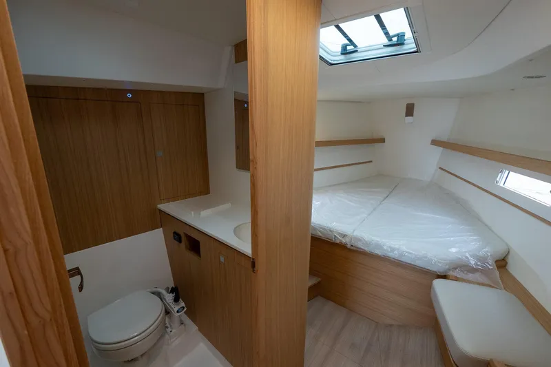 Slide: The Image of 2026 J Boats J/40 interior cabin with bed, skylight, and compact bathroom. - 45