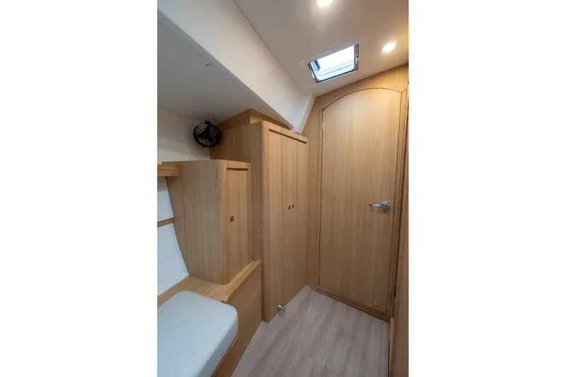 Slide: The Image of Interior of 2026 J Boats J/40, featuring sleek wood paneling and modern design. - 47