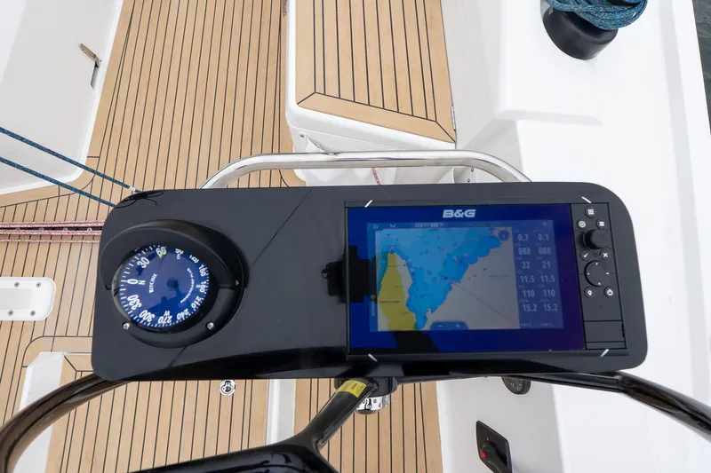 Slide: The Image of 2026 J Boats J/40 cockpit with navigation display and compass on teak deck. - 5