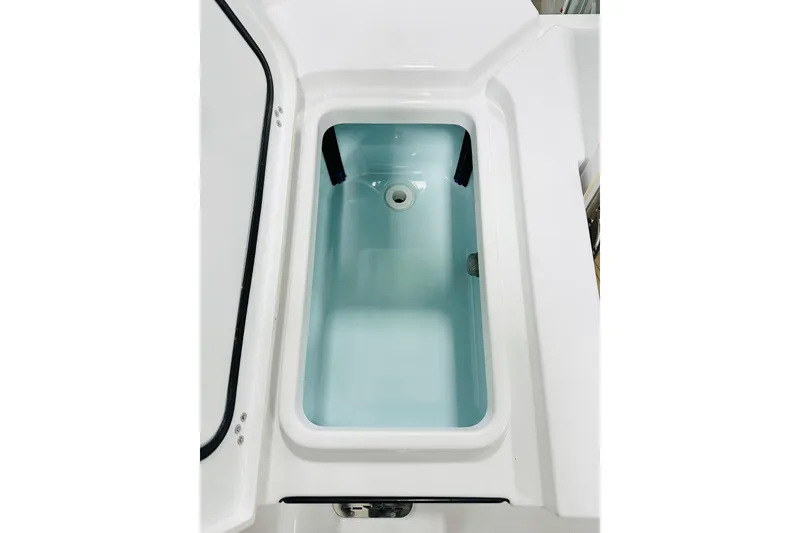 Slide: The Image of Livewell compartment in 2026 Sportsman Masters 247 Bay Boat, featuring clean design and functionality. - 14