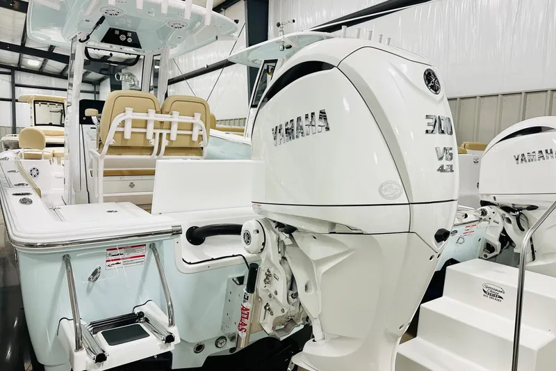 Slide: The Image of 2026 Sportsman Masters 247 Bay Boat with Yamaha 300 V6 engine in showroom. - 15