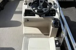 Slide: The Image of 2026 Avalon VENTURE 85 CRUISE boat interior with steering console and seating. - 6