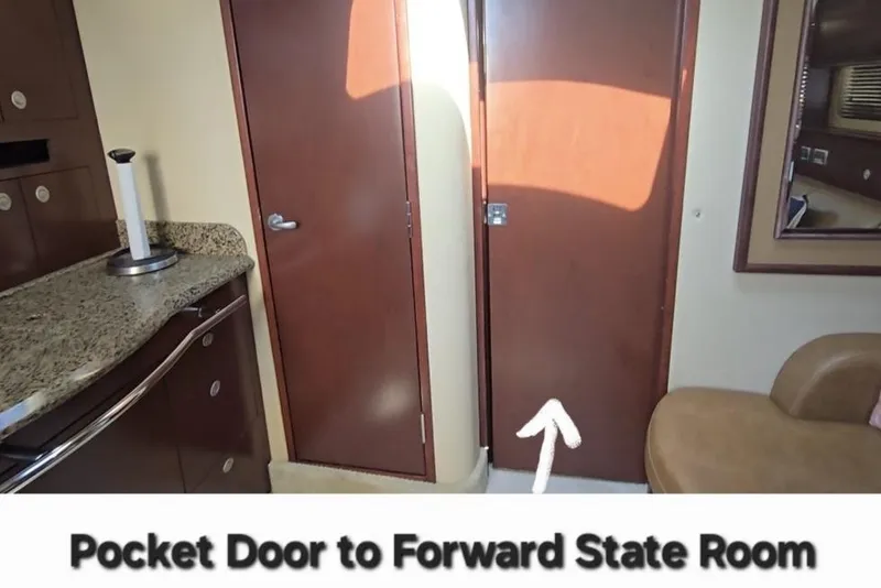 Slide: The Image of Interior of 2007 Sea Ray 40 Sundancer with pocket door to forward state room. - 20