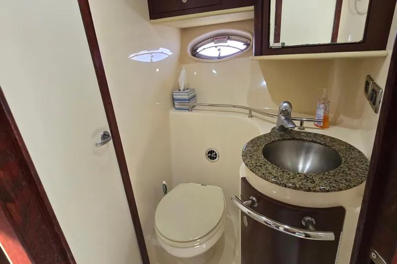 Slide: The Image of Luxurious bathroom in 2007 Sea Ray 40 Sundancer yacht with granite countertop and stainless steel sink. - 27