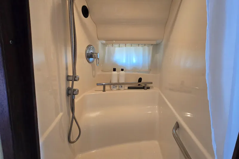 Slide: The Image of Shower area in 2007 Sea Ray 40 Sundancer yacht with modern fixtures and toiletries. - 28