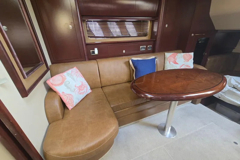 Slide: The Image of Luxurious 2007 Sea Ray 40 Sundancer interior with leather seating and elegant wooden table. - 34