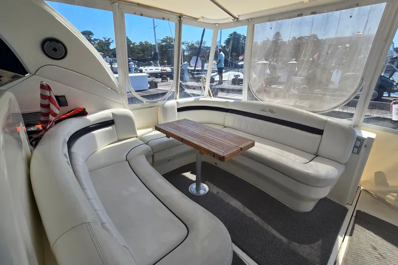 Slide: The Image of Luxurious 2007 Sea Ray 40 Sundancer yacht interior with plush seating and wooden table. - 35