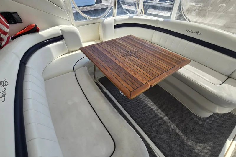 Slide: The Image of Luxurious 2007 Sea Ray 40 Sundancer interior with elegant seating and wooden table. - 4