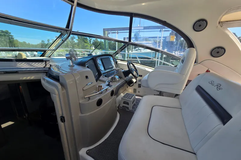 Slide: The Image of 2007 Sea Ray 40 Sundancer helm with modern controls and comfortable seating. - 5