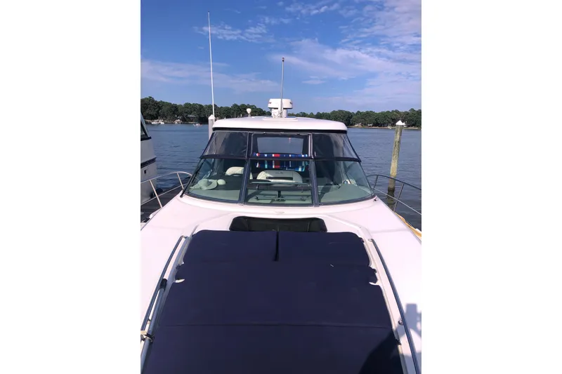 Slide: The Image of 2007 Sea Ray 40 Sundancer yacht docked on a sunny day, front view. - 9