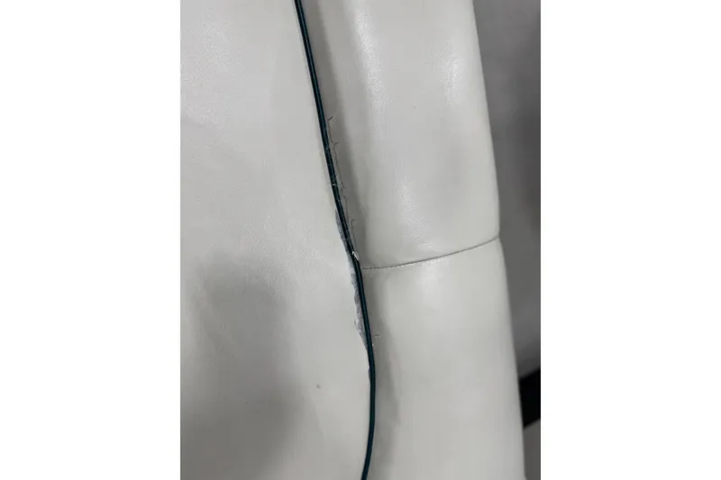 Slide: The Image of Close-up of 1998 Crownline 202 BR boat seat with visible stitching. - 10