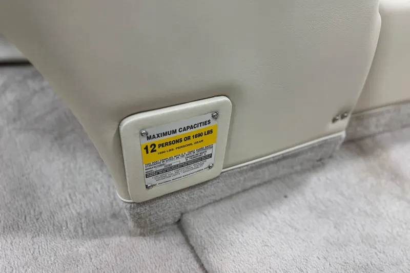 Slide: The Image of 1998 Crownline 202 BR boat capacity label, seating for 12 people or 1690 lbs. - 14