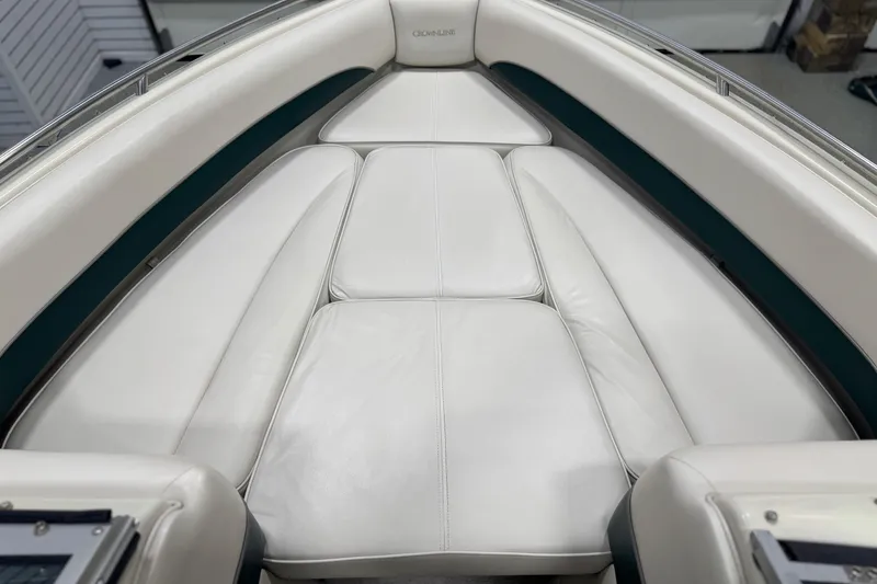Slide: The Image of 1998 Crownline 202 BR boat interior with white cushioned seating. - 17