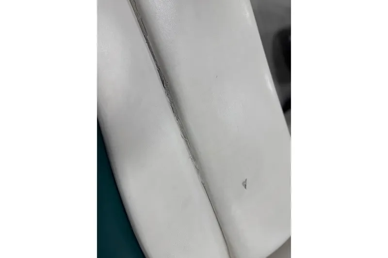 Slide: The Image of Close-up of 1998 Crownline 202 BR boat seat with visible seam and small tear. - 8