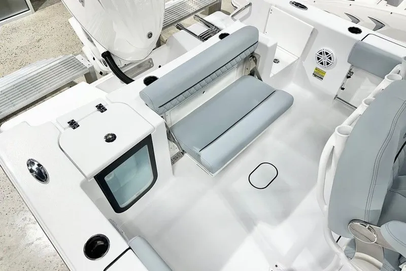 Slide: The Image of 2026 Sportsman Open 232 Center Console boat interior with seating and storage features. - 13
