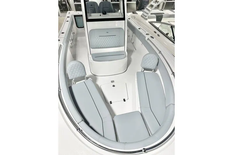 Slide: The Image of 2026 Sportsman Open 232 Center Console boat interior with cushioned seating and modern design. - 6