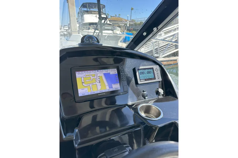 Slide: The Image of 2021 Jeanneau NC895 helm with Garmin navigation system and digital display. - 13