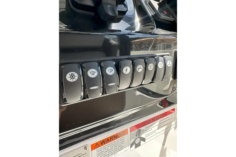 Slide: The Image of Control panel of a 2021 Jeanneau NC895 boat with labeled switches. - 19