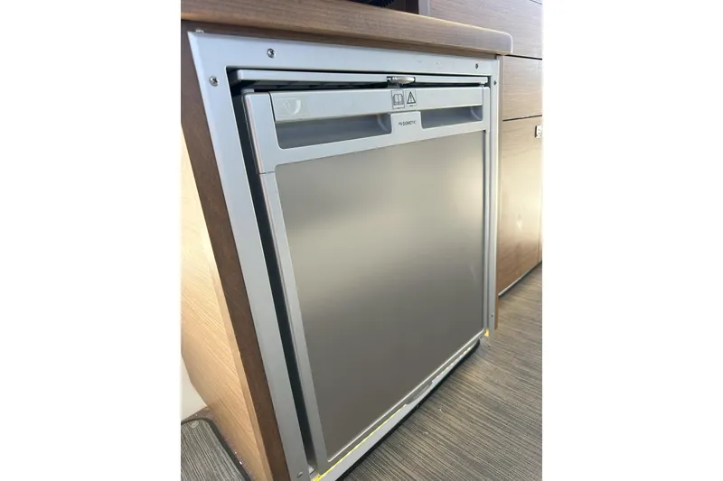 Slide: The Image of Compact refrigerator in 2021 Jeanneau NC895 boat interior. - 27