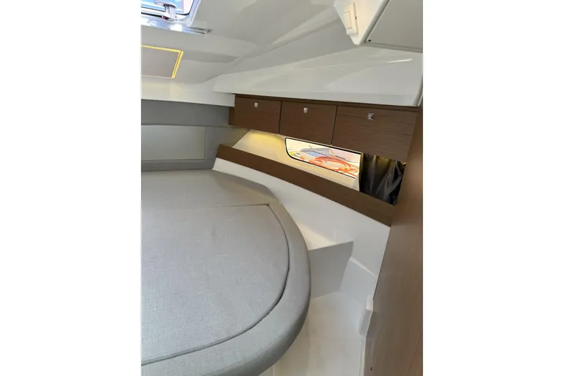 Slide: The Image of 2021 Jeanneau NC895 cabin interior with modern design and wood accents. - 30