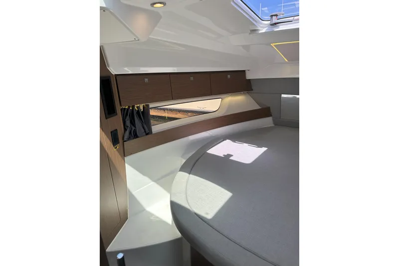 Slide: The Image of Interior cabin of 2021 Jeanneau NC895 boat with modern design and natural light. - 31
