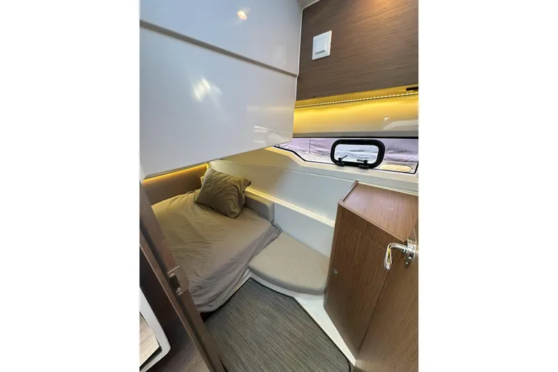 Slide: The Image of 2021 Jeanneau NC895 cabin interior with cozy bed and modern design. - 37