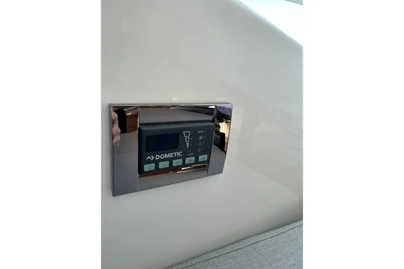 Slide: The Image of Dometic control panel on 2021 Jeanneau NC895 boat interior. - 40