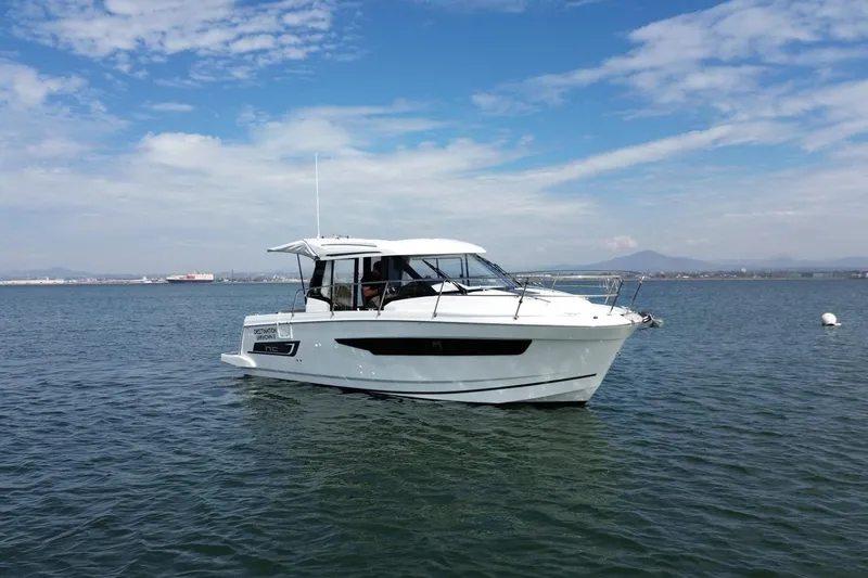 Slide: The Image of 2021 Jeanneau NC895 boat on calm water under a blue sky. - 46