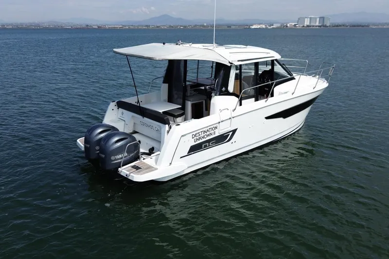 Slide: The Image of 2021 Jeanneau NC895 boat on water with twin Yamaha engines, Coronado, CA. - 48