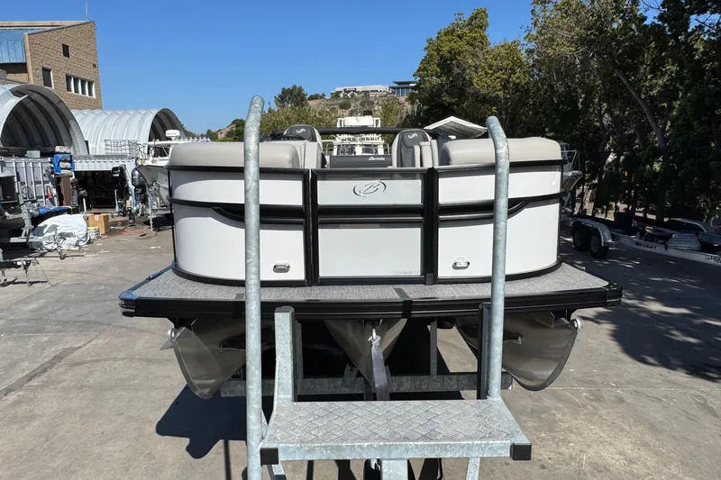 Slide: The Image of 2026 Barletta Cabrio 22UC pontoon boat on a trailer, outdoor setting. - 29