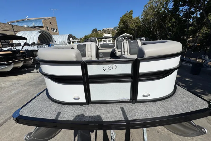 Slide: The Image of 2026 Barletta Cabrio 22UC pontoon boat with sleek design, docked outdoors. - 31